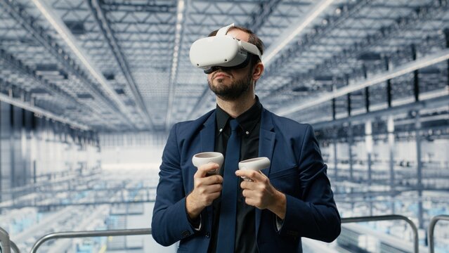 Man and coworker use VR goggles to review microchip production and semiconductor processes, applying virtual reality simulation in an Industry 4.0 manufacturing factory with colleagues.