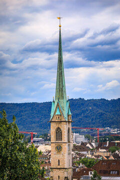 Historic church spires above tiled old town roofs, Zurich, Switzerland cityscape