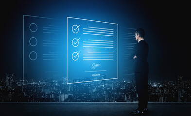 Obraz premium A business professional stands in front of holographic digital documents and a checklist, reflecting on modern technology and urban success at night in a futuristic setting. Cyphers
