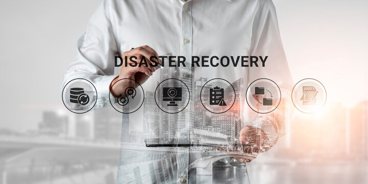 A business professional outlines disaster recovery strategies with an urban skyline backdrop, emphasizing the importance of planning and management for business continuity and resilience. Ledger