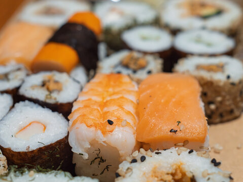 Sushi Platter with Various Japanese Rolls and Ingredients