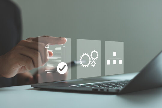 Standard operating procedure (SOP) concept. Businessman use laptop and smartphone with virtual SOP icons that include instructions, quality, process, operation, sequence and workflow.