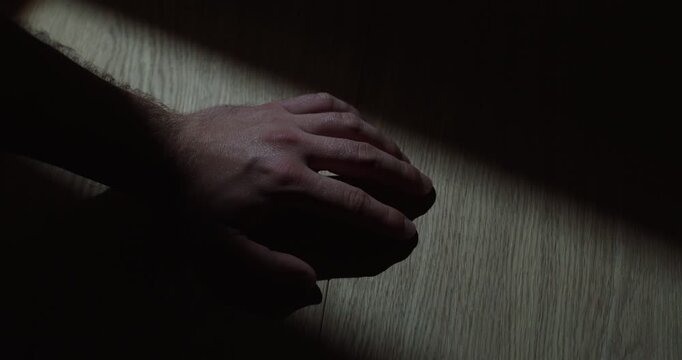 Person repeatedly taps a finger on the table, expressing impatience, nervousness, waiting or restlessness.