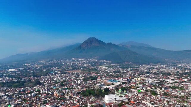 Aerial view of Batu city with Panderman mountain in the background, Batu, East Java, Indonesia.