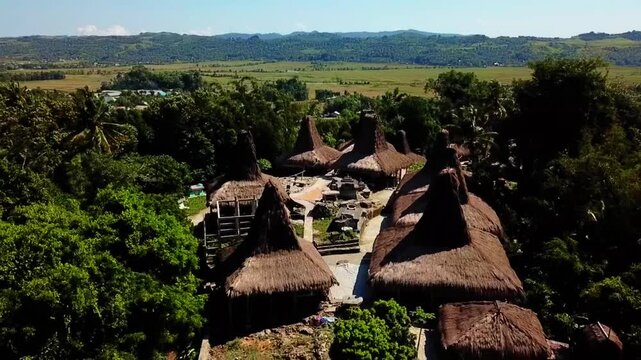 Aerial view of the traditional thatched roof houses at Prai Ijing Traditional Village in Kota Walkabubak, East Nusa Tenggara, Indonesia.