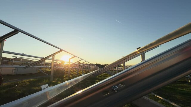 Solar Power Plant Frame Construction at Sunset for Sustainable Energy
