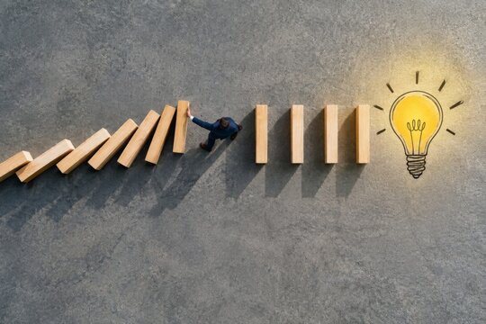 Domino Chain Stopped Before Glowing Light Bulb