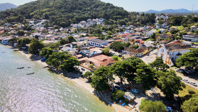 High angle diagonal drone view over the traditional coastal village and architecture of Santo Antonio de Lisboa, Florianopolis, Brazil.
