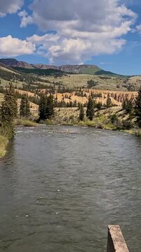 Sweeping Vertical View Of Drift Boat With Anglers Floating Down The  Rio Grande River In Colorado