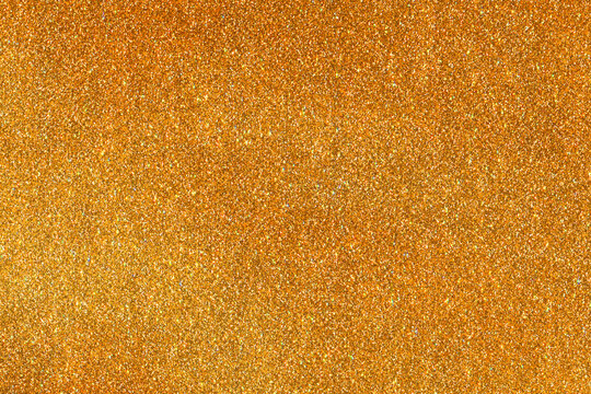 Golden glitter texture background for luxury branding projects and festive web design presentation