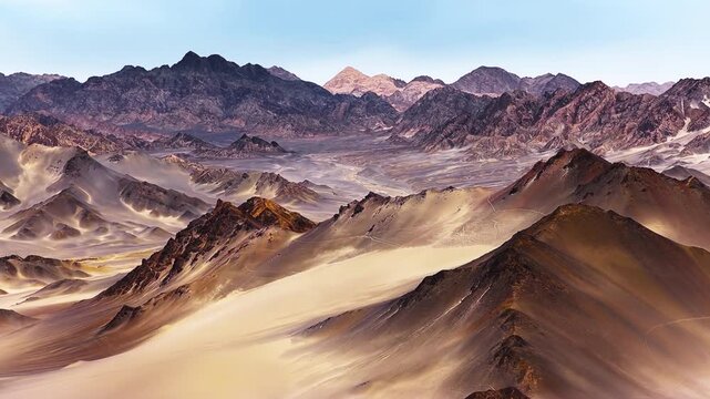 Majestic view of desolate desert mountain peaks under bright clear day light in Qinghai Province.