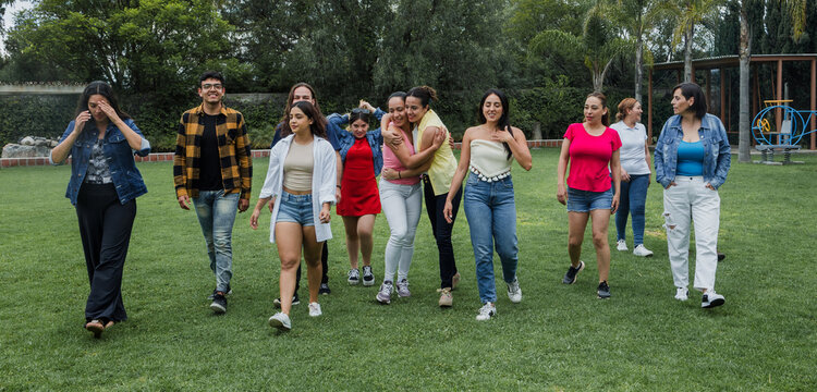 group of latin people having fun outdoors in Mexico Latin America, large and diverse group of hispanic people of different ages, multi age and inclusive concept