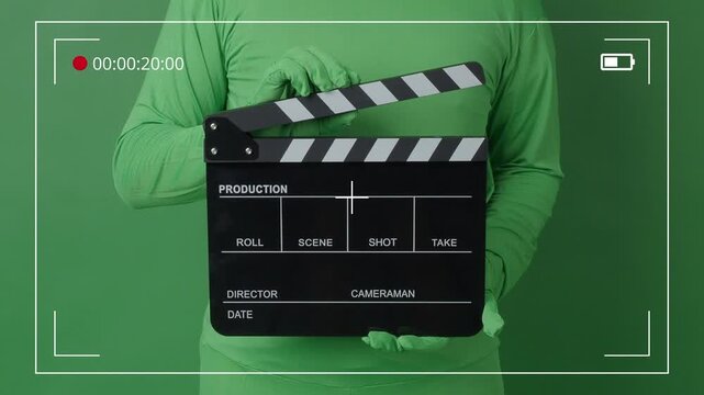 Super Movie Clapper Board Clapped By Hands On Green Screen Camera Background
