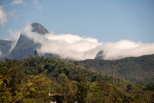Clouds drifting over tropical mountain peaks