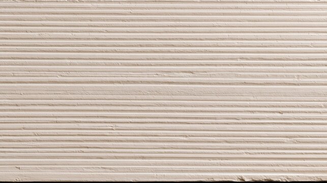Close-up view of a light beige wall surface featuring horizontal parallel lines and a subtle textured plaster finish for interior decor