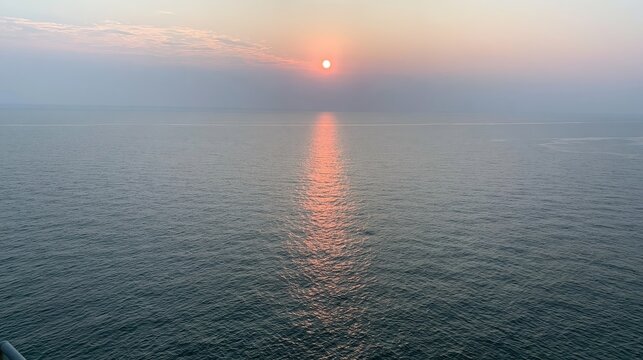 Sunset over the ocean with reflection