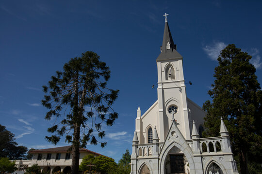 Afternoon sun shines on a historic church in downtown Santa Cruz, California, USA.