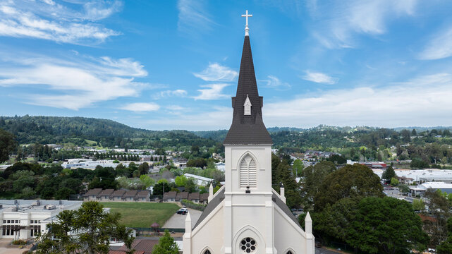 Afternoon sun shines on a historic church in downtown Santa Cruz, California, USA.