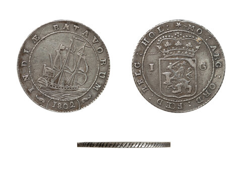 Detailed studio photograph of an antique 1802 Batavorum one gulden silver coin, presented in obverse, reverse, and edge views.