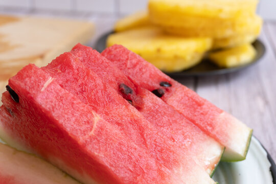 Fresh watermelon slices with juicy red flesh and black seeds