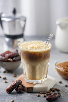 Iced coffee dates latte cup. Alternative trendy vegan drink