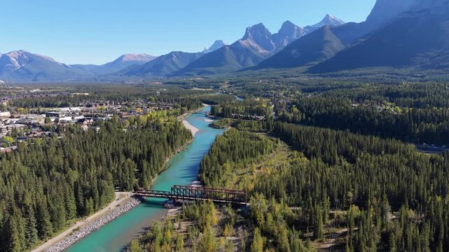 Majestic Three Sisters mountains towering over Canadian Rockies Bow River valley. Canmore, Alberta, Canada. Canmore Engine Bridge.