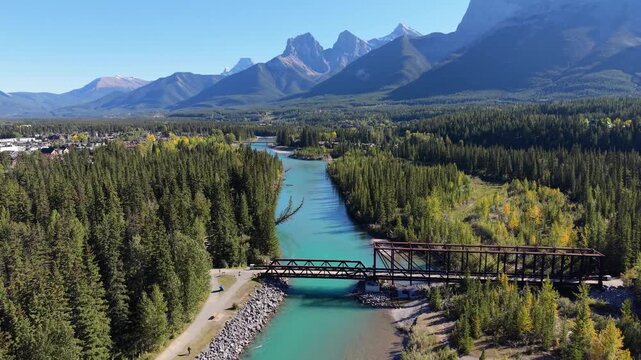 Majestic Three Sisters mountains towering over Canadian Rockies Bow River valley. Canmore, Alberta, Canada. Canmore Engine Bridge.