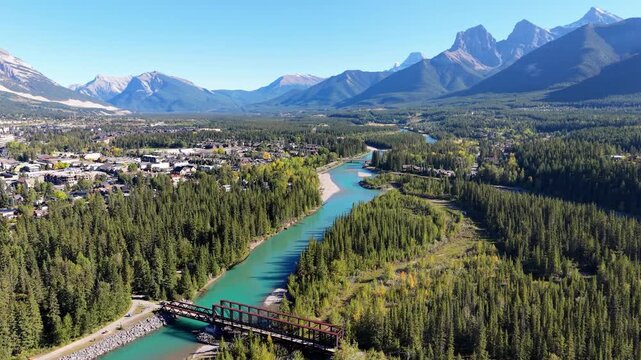 Majestic Three Sisters mountains towering over Canadian Rockies Bow River valley. Canmore, Alberta, Canada. Canmore Engine Bridge.
