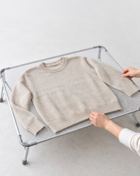 Flat Drying a Wool Sweater on a Mesh Drying Rack
