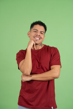 Young adult man smiling, feeling happy