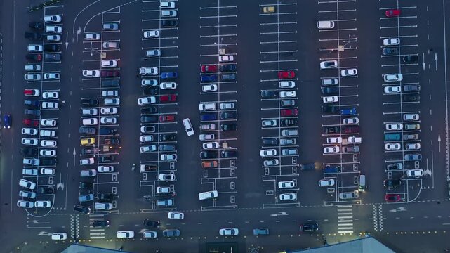 Aerial view of a large parking lot with many cars parked in orderly rows, Russia.