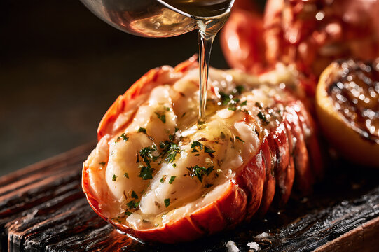 grilled lobster tail split open and basted with garlic herb butter
