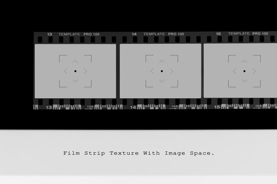 Horizontal photographic film negative border with focus marks and DX code edge markings.
