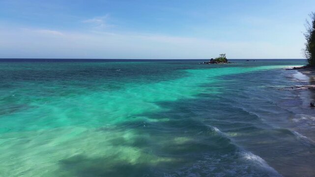 Aerial View of Tropical Beach with Turquoise Water and Island