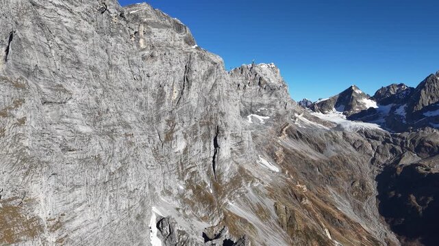 Massive rockface in Switzerland on a sunny day shot on the DJI Air 3s drone. Smooth 4K 60fps.
