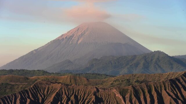 Scenery view of Mount Semeru volcano, Indonesia's highest and most active volcano on Java, frequently emits smoke, ash, and steam plumes.