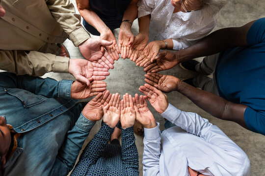 Diverse hands forming unity circle