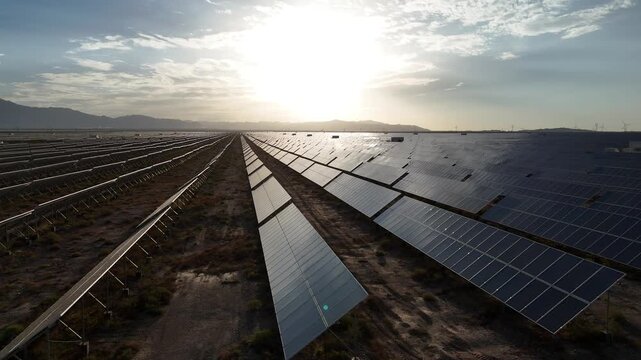 Rows of solar panels in a vast desert landscape