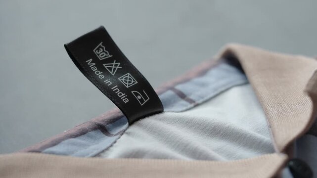Shirt tag showing care instructions and country of origin