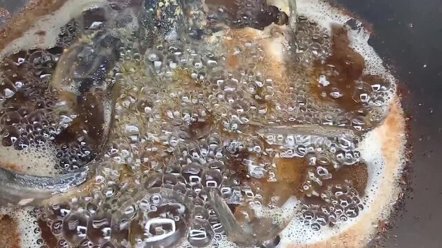 frying Crispy catfish&nbsp;in a pan filled with hot oil, frying catfish becomes dry and crispy in boiling oil