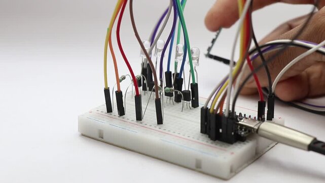 Breadboard with jumper cables connecting components demonstrating gyro sensor output shown on led lights