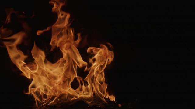 Flame pattern. Flames on black slow motion. Glowing flames on black slow motion. Inferno effect with flame. Blazing fire. Flame slow motion. Intense blazing fire slow motion.
