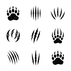 Fototapeta premium Black animal paw print and claw mark icons set isolated on white background design element