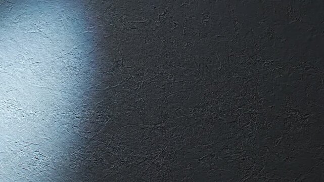 Dynamic spotlight scanning across a textured dark gray wall surface