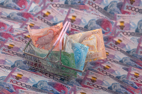 Kazakhstani tenge banknotes in a shopping basket