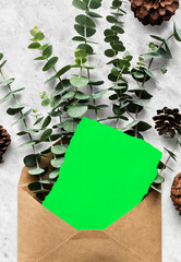 Rustic envelope with eucalyptus greenery, suitable as mockup © Rawpixel.com