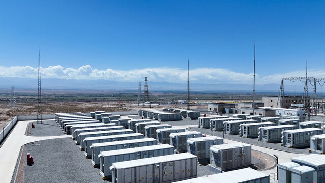 rows of outdoor energy storage battery containers under blue sky