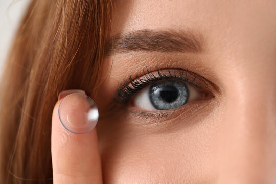 Vision correction and eye health, woman applying a contact lens for clear sight and ophthalmology care in a close up portrait of natural beauty