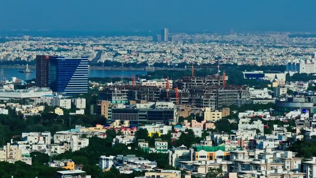 Pranava One hsel commercial building with apartments, under construction NIMS building and Secretariat at hyderabad, telangana, india. day time, trucking shot, drone shot, 4k.