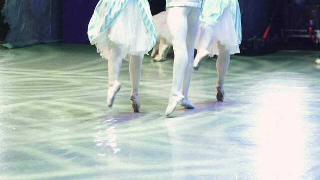 Ballet dancers in blue and white costumes perform French dance from The Nutcracker